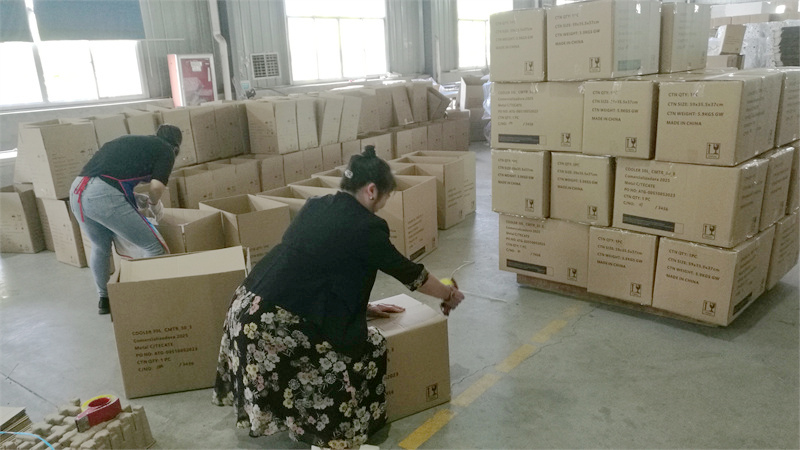 Manufacturing partner packing coolers in cartons